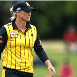 A dynamic image of Sophie Devine, the New Zealand cricketer, hitting a powerful shot on the field with a cheering crowd in the background.